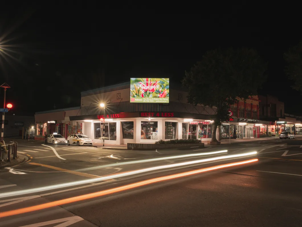 Night time photos of digital billboard on corner of Gover & Devon Streets, New Plymouth.